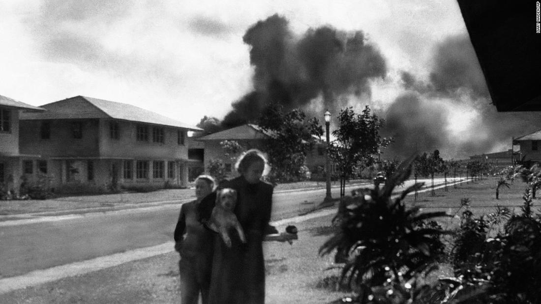 Wives of US military officers return to their residences after an explosion at Pearl Harbor.