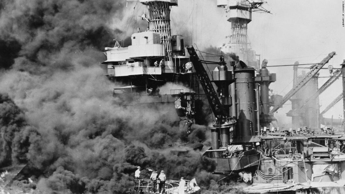 A rescue boat retrieves a seaman from the burning USS West Virginia after the Japanese attacked Pearl Harbor on December 7, 1941.
