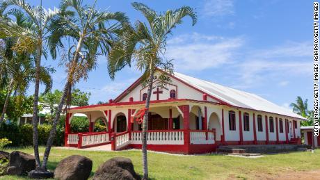 Red flags are seen hanging outside of homes of residents indicating they have not been vaccinated for measles on December 5, 2019 in Apia, Samoa.