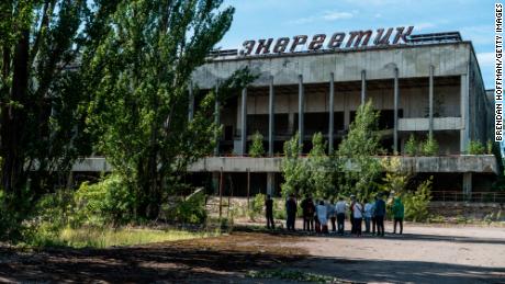 Tourists are guided around the abandoned city of Pripyat, inside the Chernobyl exclusion zone, in 2019. 