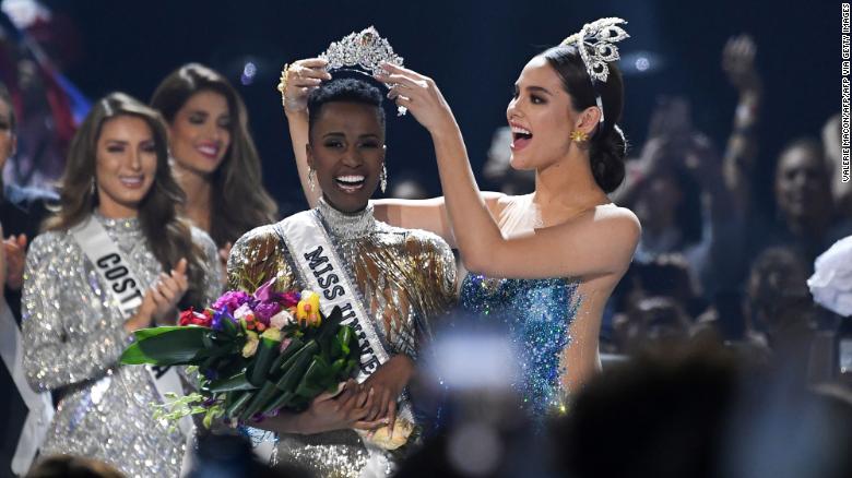 Miss Universe 2018 Catriona Gray of the Philippines crowns the new Miss Universe 2019, South Africa's Zozibini Tunzi, during the pageant at Tyler Perry Studios in Atlanta, Georgia, on December 8, 2019. 