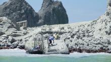 Tour operators prepare to evacuate visitors who were on the island during the eruption.