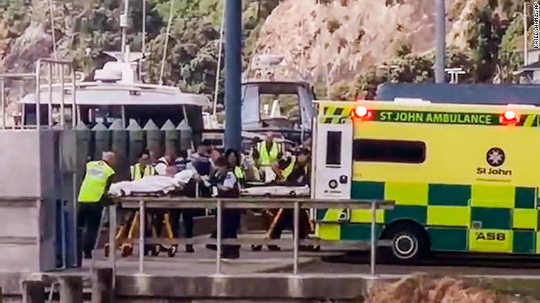 Injured from White Island volcanic eruption are ferried into waiting ambulances in Whakatane, New Zealand, Monday.
