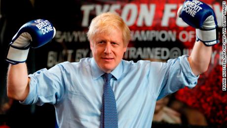 Boris Johnson wears boxing gloves emblazoned with &quot;Get Brexit Done&quot; during a stop in Manchester in late November. 