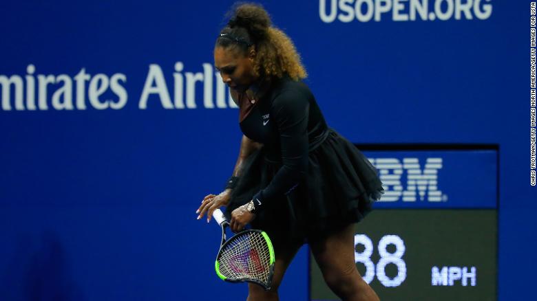 Williams carries her racket off the court during the 2018 US Open final. 