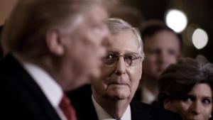 US President Donald Trump (L) talks to the press as Senate Majority Leader Mitch McConnell (R-KY) looks on after the Republican luncheon at the U.S. Capitol Building on January 9, 2019 in Washington, DC. 