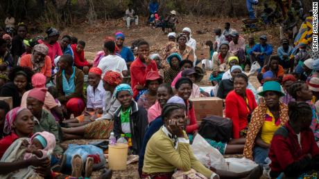 A crowd waits for food aid distribution to begin in Kasibo, Zimbabwe. 