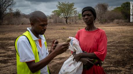 Once a proud farmer, Felistus Ncube now stands in line for food aid. 