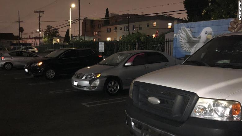 Homeless car dwellers settle in for the night at a Safe Parking LA lot in Koreatown.
