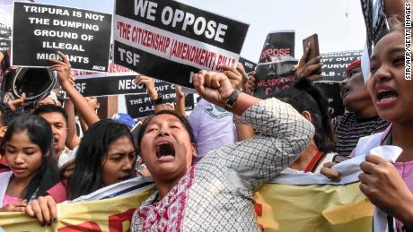 Demonstrators shout slogans as they hold placards to protest against the government&#39;s Citizenship Amendment Bill in Agartala in India&#39;s northeast state of Tripura.