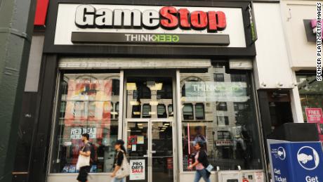 NEW YORK, NEW YORK - SEPTEMBER 16: People pass a GameStop store in lower Manhattan on September 16, 2019 in New York City. GameStop has announced that they will be closing between 180 and 200 stores before the end of the fiscal year due to a drop in sales. (Photo by Spencer Platt/Getty Images)