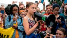 WASHINGTON, DC - SEPTEMBER 13:  Teenage Swedish climate activist Greta Thunberg delivers brief remarks surrounded by other student environmental advocates during a strike to demand action be taken on climate change outside the White House on September 13, 2019 in Washington, DC. The strike is part of Thunberg's six day visit to Washington ahead of the Global Climate Strike scheduled for September 20. (Photo by Sarah Silbiger/Getty Images)