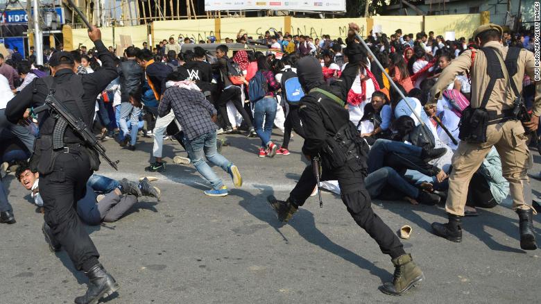 Security personnel use batons to disperse students protesting against the government&#39;s Citizenship Amendment Bill (CAB), in Guwahati on December 11, 2019.