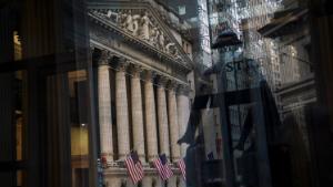 NEW YORK, NY - DECEMBER 27: The New York Stock Exchange (NYSE) is reflected in a window at Federal Hall, December 27, 2018 in New York City. After falling over 600 points earlier in the trading session, the Dow Jones Industrial Average ended the day up 260 points. (Photo by Drew Angerer/Getty Images)