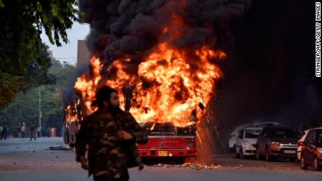 A burning bus, following a demonstration against the Indian government&#39;s Citizenship Amendment Bill (CAB) in New Delhi on Sunday.  