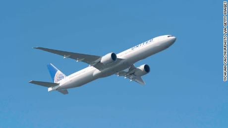 A passenger records video of flames coming from an engine as a United flight makes an emergency landing