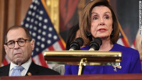 House Speaker Nancy Pelosi next to House Judiciary Chairman Jerry Nadler, Democrat of New York, announces articles of impeachment for US President Donald Trump. 