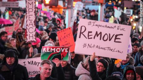 An anti-President Donald Trump crowd gather at a rally to protest and call for his impeachment.