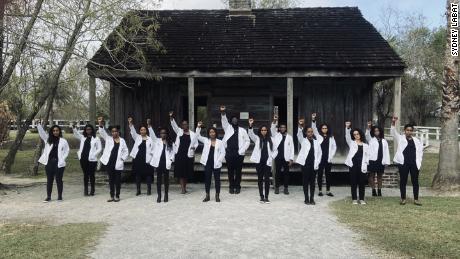 Black Tulane University medical students pose at a plantation to show how the past inspired their future