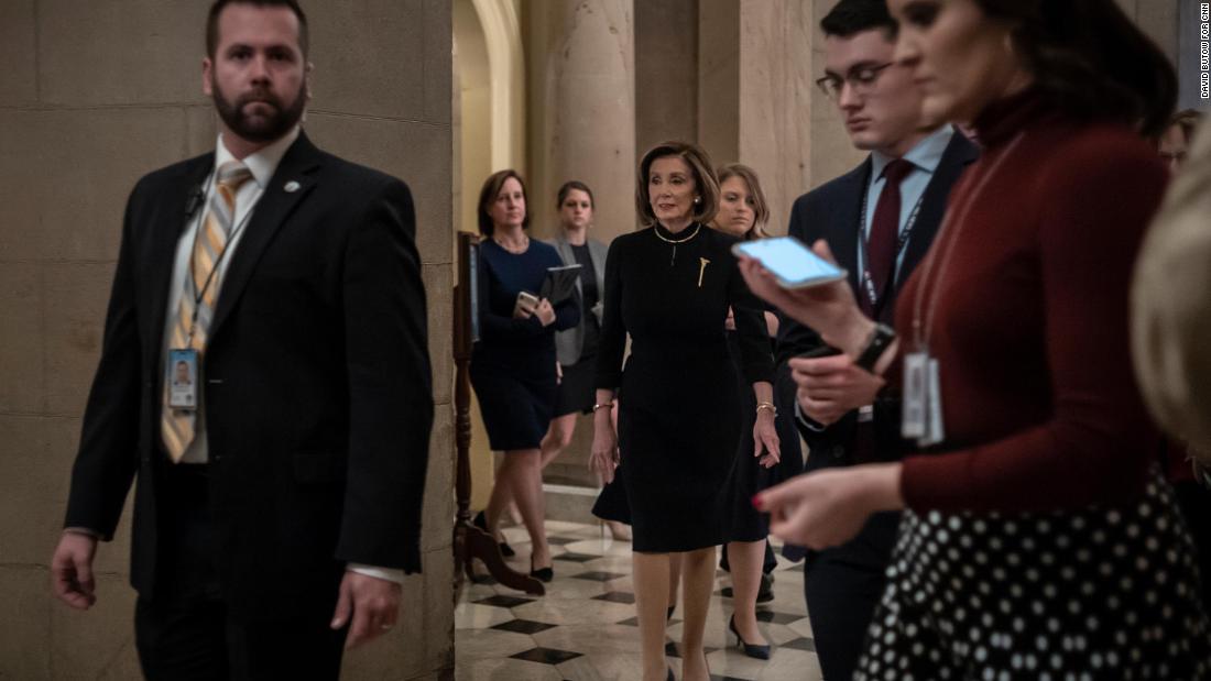 Pelosi walks from her office to the House chambers early on Wednesday.