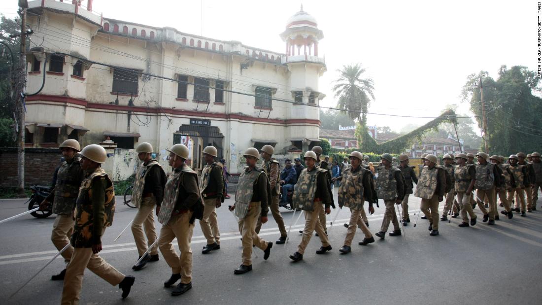 Police officials march past after the protest of students from Allahabad University on December 17.