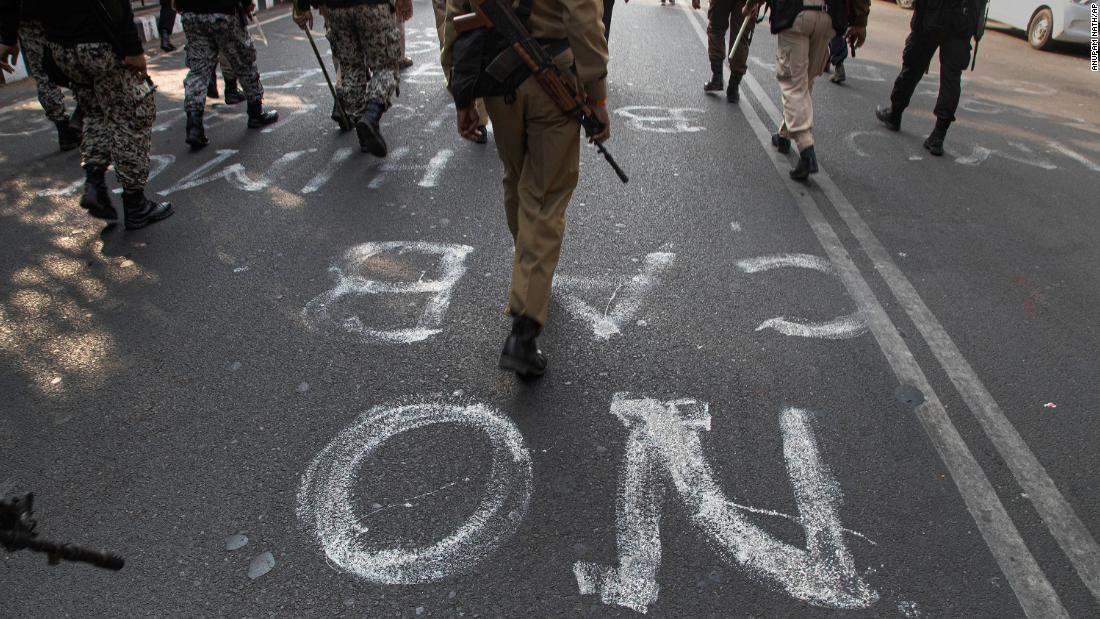 Indian police commandos walk along during a protest in Gauhati, India, December 18.