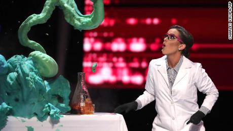 Camille Schrier performs a science experiment prior to winning the Miss America competition Thursday night at the Mohegan Sun casino in Uncasville, Conn.