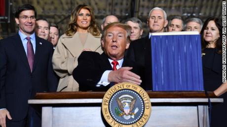 Defense Secretary Mark Esper, First Lady Melania Trump, Vice President Mike Pence and Karen Pence watch US President Donald Trump sign the &quot;National Defense Authorization Act for FY2020&quot; at Joint Base Andrews, Maryland on December 20, 2019. (Photo by Nicholas Kamm / AFP) (Photo by NICHOLAS KAMM/AFP via Getty Images)