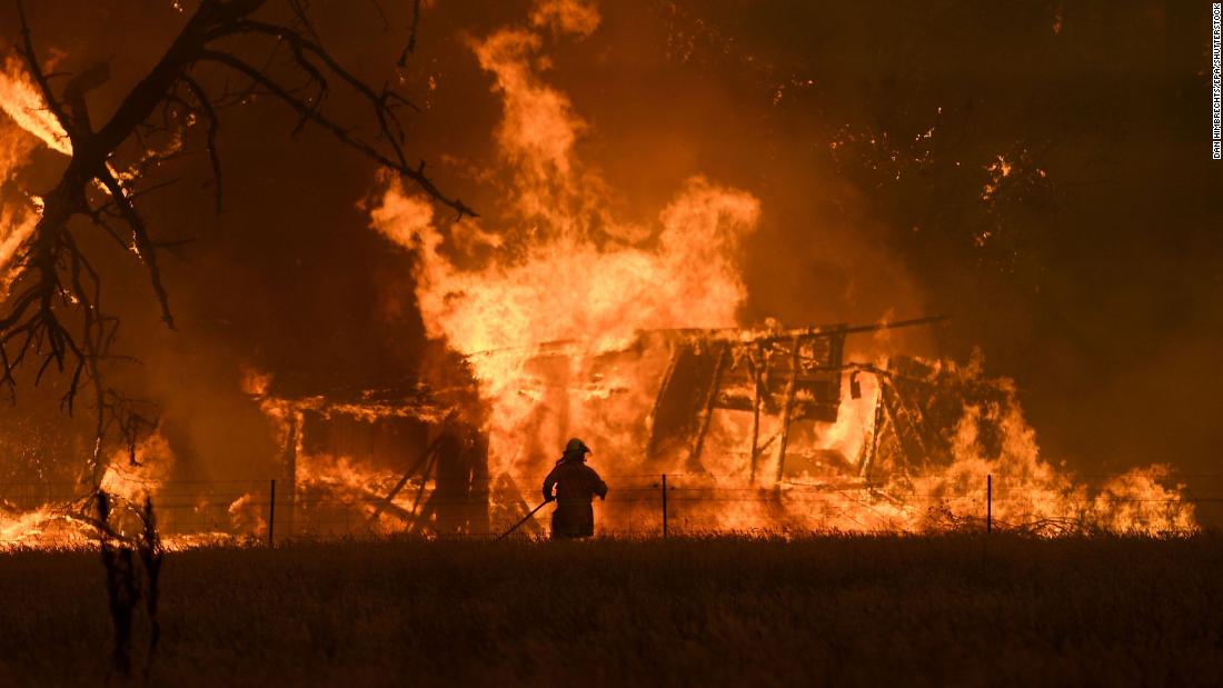 A firefighter battles the Gospers Mountain Fire in Bilpin, New South Wales, on Saturday, December 21.