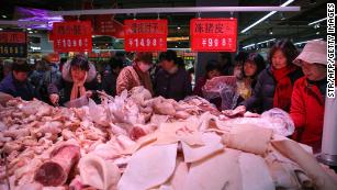 China cuts some tariffs to boost trade and take heat out of pork prices