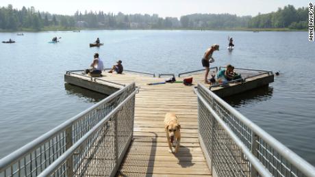 Alaskans who routinely pack knit caps and fleece jackets in summer were swapping them for sunscreen and parasols at DeLong Lake amid a prolonged heatwave.