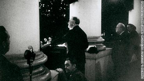 President Franklin D. Roosevelt and Prime Minister Winston Churchill on the South Portico of the White House during the National Christmas Tree Lighting ceremony, December 24, 1941.