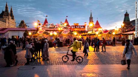 People walk at Holiday&#39;s Market on Red Square in Moscow on Friday, December 20. 