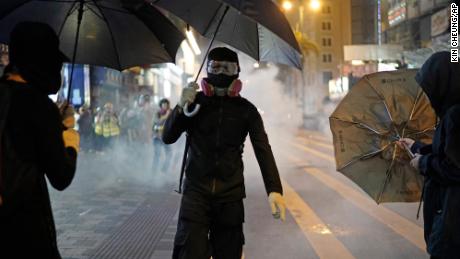 Tear gas is seen on the streets of Hong Kong on Christmas Eve.