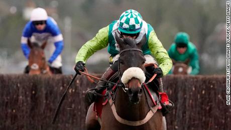 Sam Twiston-Davies pulls clear on Clan Des Obeaux to win the King George VI Chase at Kempton Park from stablemate Cyrname. 