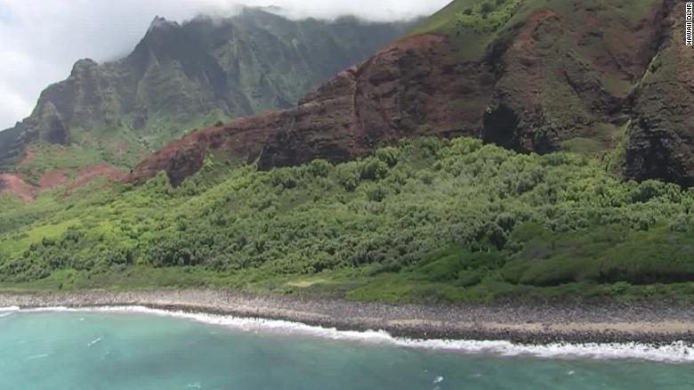Coast Guard crews are searching by air and in the water for an overdue helicopter with seven people onboard that failed to return from a tour off Kauai&#39;s Na Pali coast.