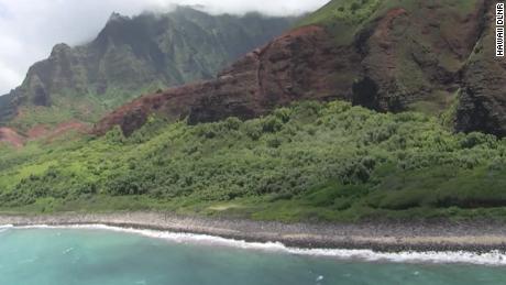 Coast Guard crews are searching by air and in the water for an overdue helicopter with seven people onboard that failed to return from a tour off Kauai&#39;s Na Pali coast.