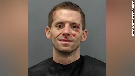 Police have caught the inmate who escaped jail by carving through a brick wall