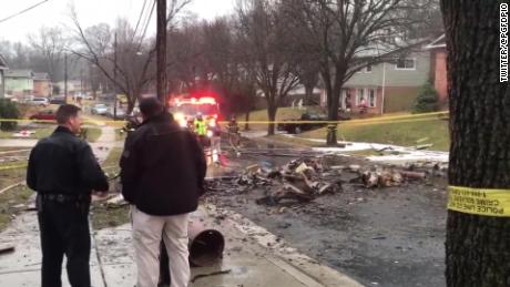 Debris littered the residential street after the plane crash in Lanham, Maryland.