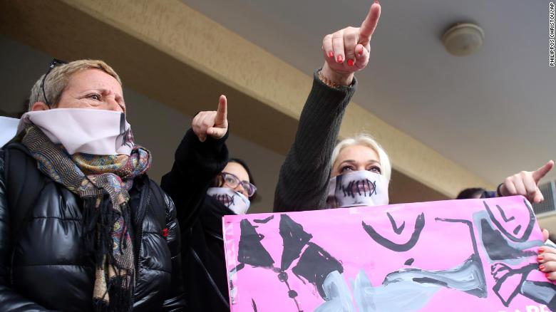 Rights activists stage a demonstration outside the court in Cyprus on Monday. 
