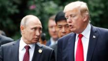 US President Donald Trump (R) and Russia&#39;s President Vladimir Putin talk as they make their way to take the &quot;family photo&quot; during the Asia-Pacific Economic Cooperation (APEC) leaders&#39; summit in the central Vietnamese city of Danang on November 11, 2017.
World leaders and senior business figures are gathering in the Vietnamese city of Danang this week for the annual 21-member APEC summit. / AFP PHOTO / POOL / JORGE SILVA        (Photo credit should read JORGE SILVA/AFP via Getty Images)