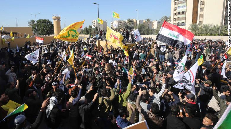 Pro-Iranian Iraqi protesters demonstrate outside the US embassy in Baghdad on Tuesday. 