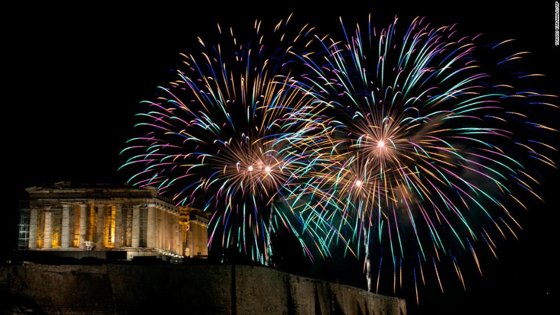 Fireworks explode over the ancient Parthenon temple on the Acropolis hill as the new year begins in Athens, Greece.