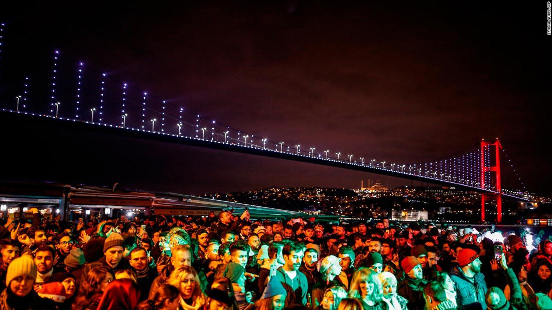 People wait for the new year in Ortakoy Square in Istanbul.