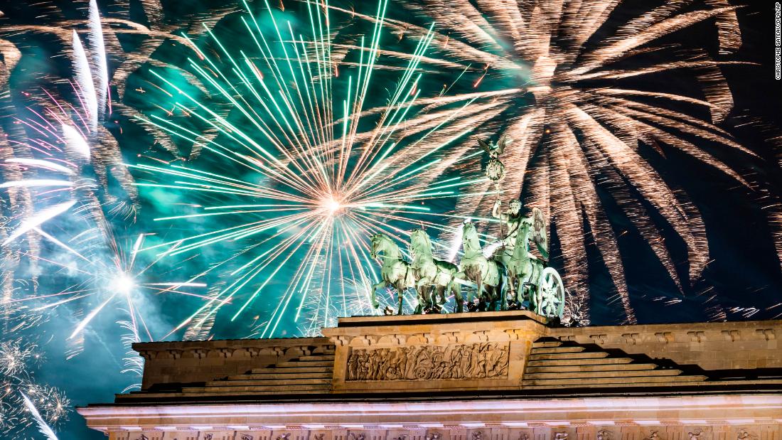 Fireworks light the sky above the Brandenburg Gate in Berlin.