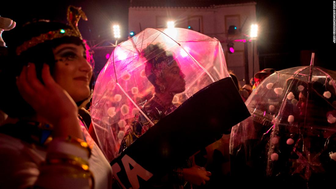 People in costumes gather to welcome the new year in Coin, Spain.