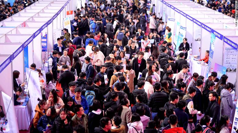 Job hunters crowd at a job fair for university graduates at Northeastern University on March 21, 2019 in Shenyang, Liaoning Province of China.