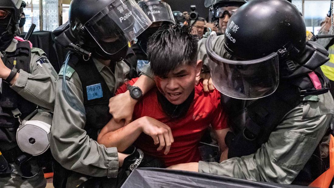A man is detained by riot police during a demonstration in a shopping mall at Sheung Shui district on December 28.
