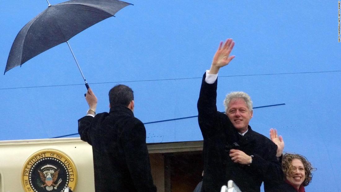 Clinton and his daughter, Chelsea, wave as they leave Washington, DC, following George W. Bush&#39;s inauguration in January 2001.