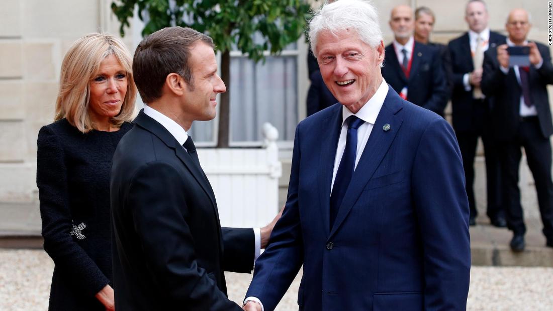 French President Emmanuel Macron and his wife, Brigitte, welcome Clinton for a lunch in Paris in September 2019. Clinton was in France to pay tribute to the late French President Jacques Chirac.